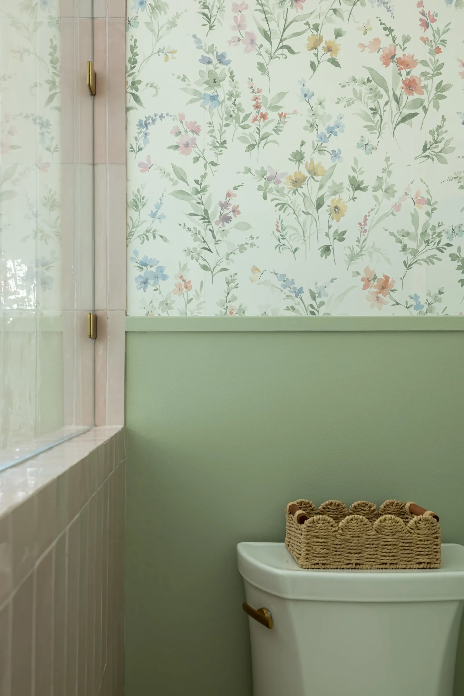 Scalloped woven basket resting on the cistern, wildflower paper meeting sage green paint